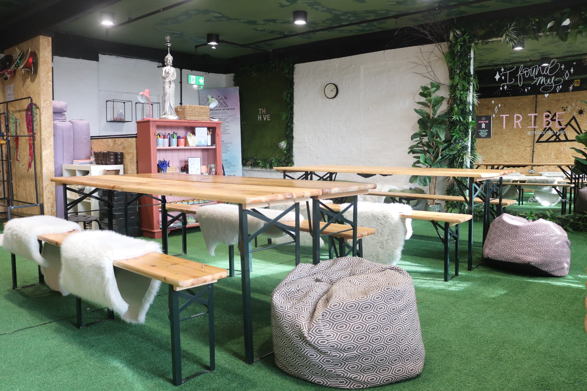 The Hive arranged with long tables and relaxed seating for a workshop or breakout session