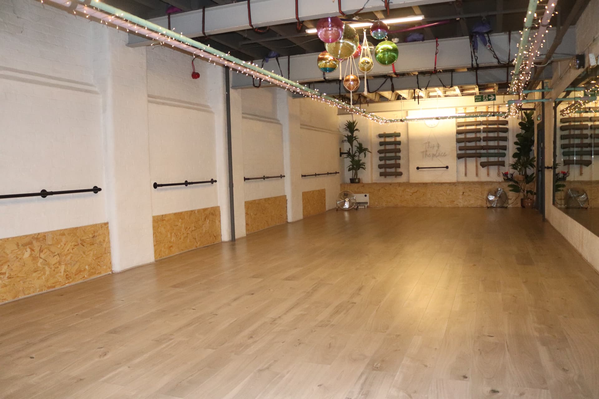 Vibe Studio viewed across its open rehearsal floor and ballet barres